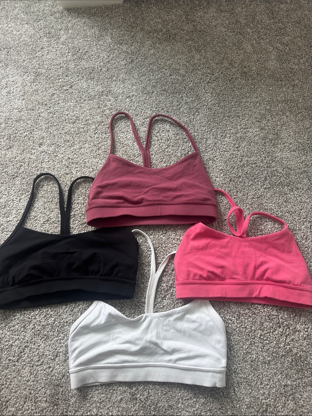 Lululemon Flow Y bras (four piece lot) in Black, White, Rose, Pink